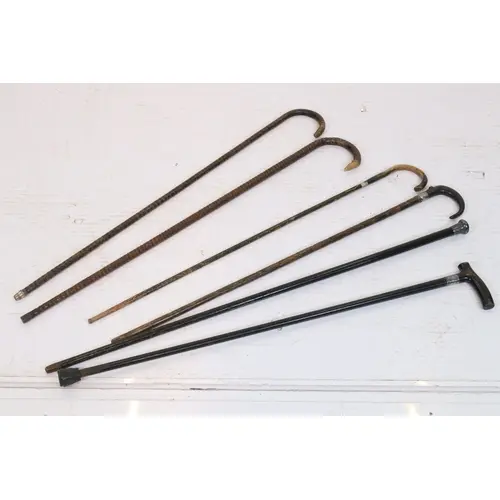 Group of six antique walking sticks, to comprise one with ha...