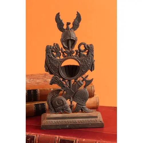 A 19th century cast iron pocket watch stand, with Greco-Roma...