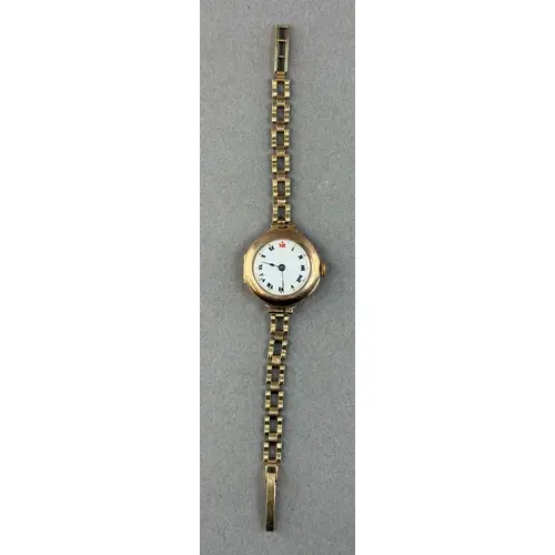 Watches: a 9ct yellow gold trench style wristwatch on open l...