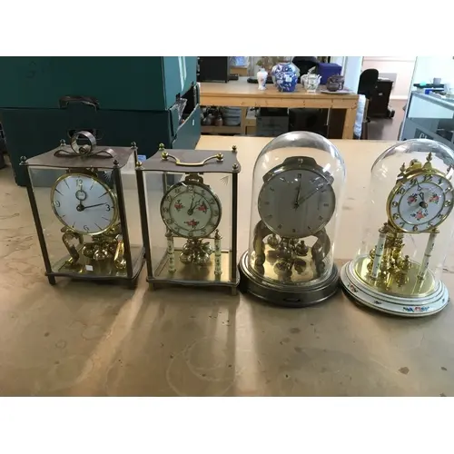 Collection of four mantle clocks including vintage Kund...