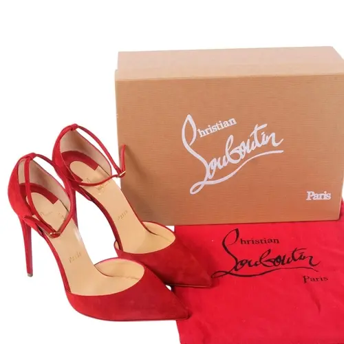 CHRISTIAN LOUBOUTIN - a pair of lady's red suede Uptown 100 ...