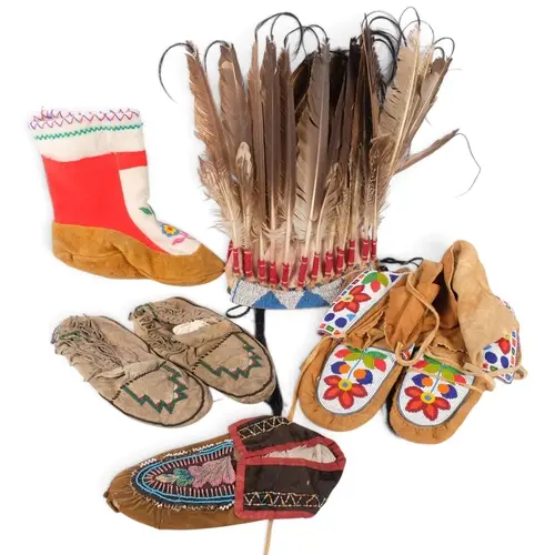 A collection of Native American artefacts, including a beadw...