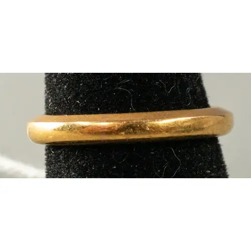 Jewellery: a 22ct yellow gold wedding band, width 2.6mm, UK ...