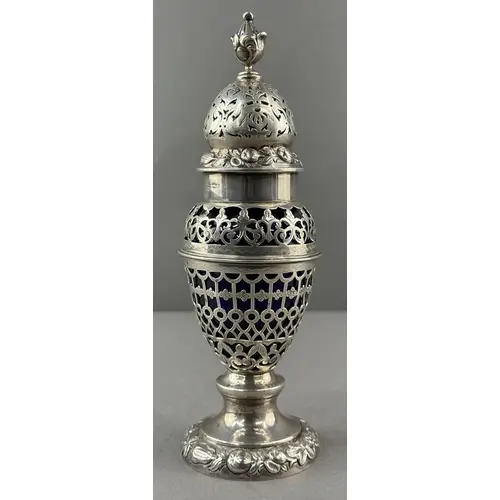 Silver: an ornate pierced sugar caster by Nathan and Hayes, ...