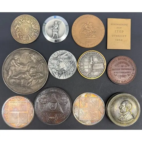 A group of 12 exhibition-related commemorative medallions, i...