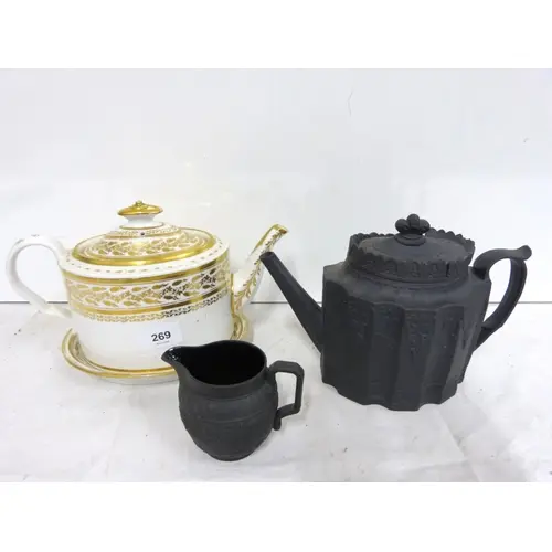 19th gilt decorated ceramic teapot on stand also a black Bas...