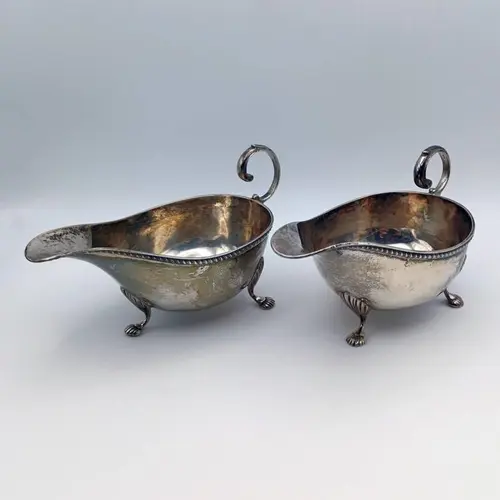 A PAIR OF SILVER SAUCE BOATS BY ASPREY & CO LTD, BIRMINGHAM ...