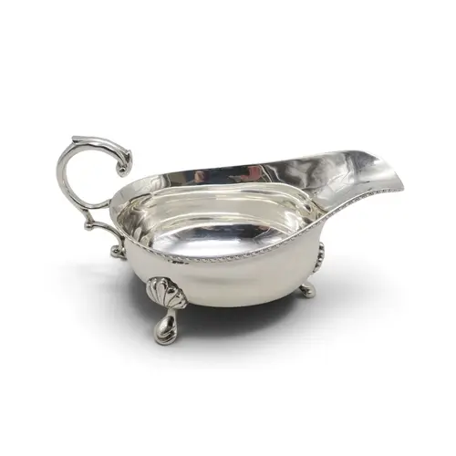 A George V silver sauce boat by Edward Barnard & Sons, L...