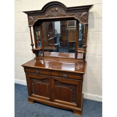 AN ART NOUVEAU WALNUT MIRROR-BACK SIDEBOARD, with an arched ...