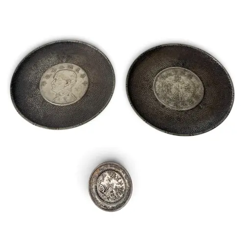 TWO CHINESE SILVER COIN DISHES AND A SILVER BROOCH Gross wei...