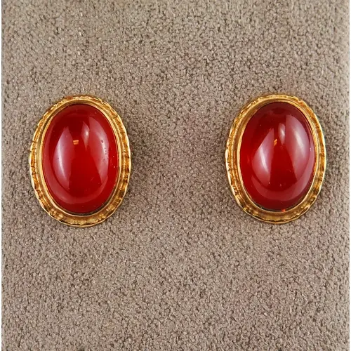 A pair of carnelian stud earrings in 9ct yellow gold setting...