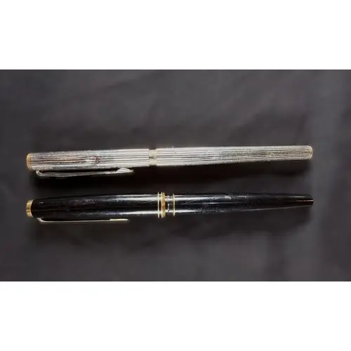 A ribbed chrome Mont Blanc fountain pen (both lid and case d...