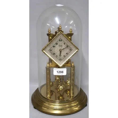Three various brass three hundred day clocks, with glass dom...