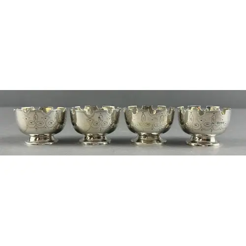 Silver: a set of four round castellated salts by Thomas Smil...