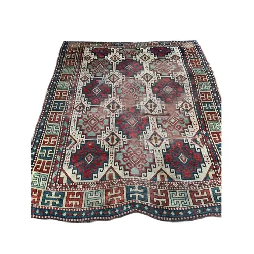 An antique Caucasian ivory ground Kazak rug, 194 x 158cm...