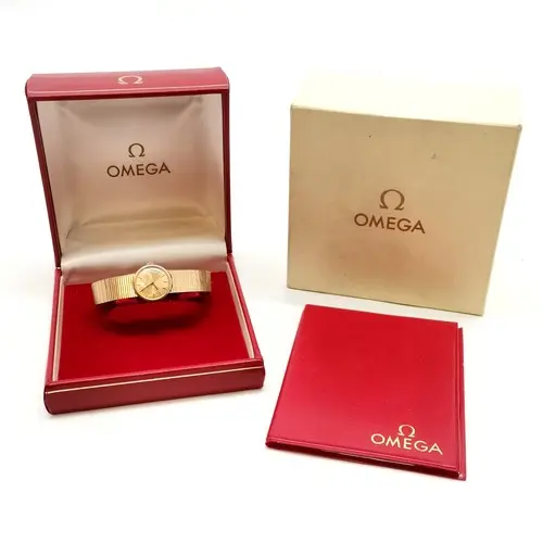 Omega ladies manual wind 9ct gold wristwatch on integral gol...