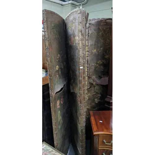 An early 20th century ebonized wood framed four fold screen,...