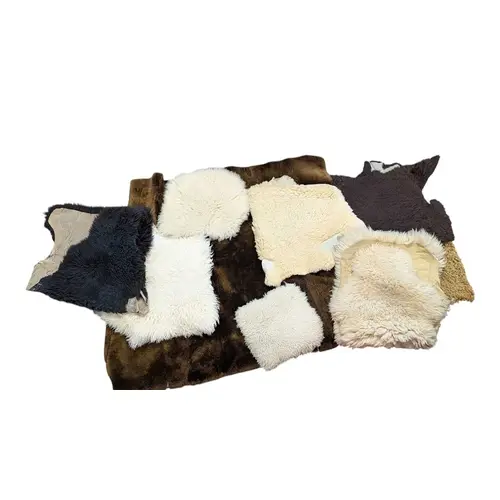 A quantity of 20th century sheepskin pelts and floor rugs, e...