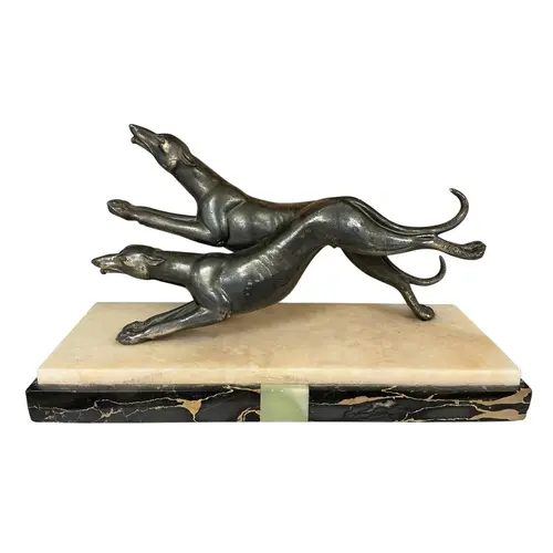 A French Art Deco spelter and marble group of running greyho...