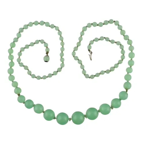 A vintage uranium glass bead necklace. The necklace with gra...