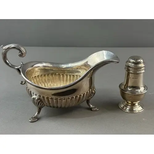 Silver: a pounce pot of baluster form by Charles Edwards, Lo...