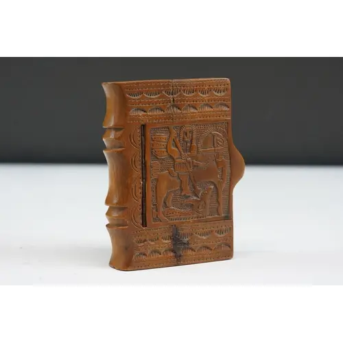Folk art treen snuff box in the form of a book, the top carv...