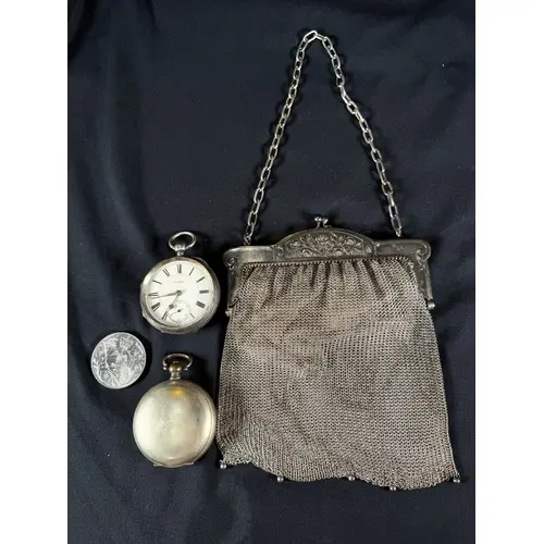 A silver cased pocket watch, another pocket watch, a vintage...