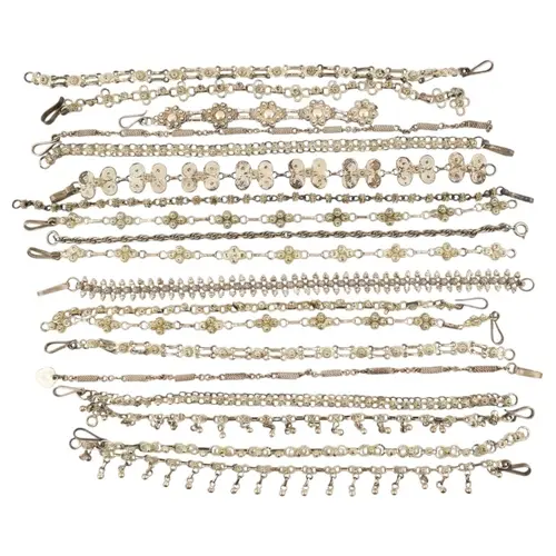 Collection of silver and white metal filigree bracelets. To ...