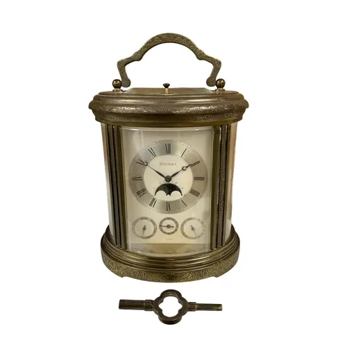 A reproduction engraved lacquered brass 'Royama' repeating c...