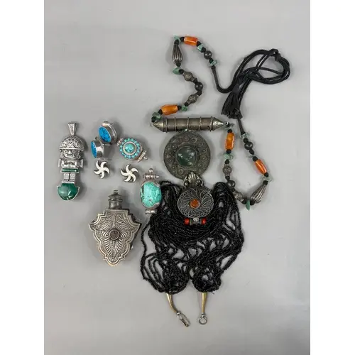 Jewellery: a South American white metal malachite set figura...