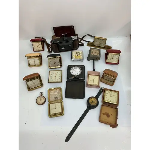 A collection of vintage travelling clocks including Swiza an...