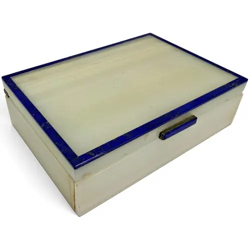 An Art Deco white agate box, banded with lapis lazuli, with ...