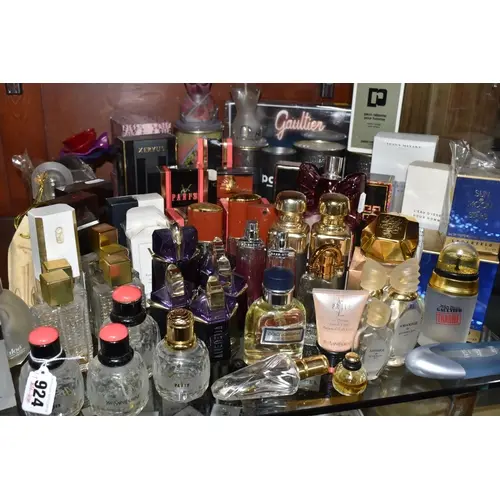 A COLLECTION OF MOSTLY EMPTY LADIES' PERFUME BOTTLES, to inc...