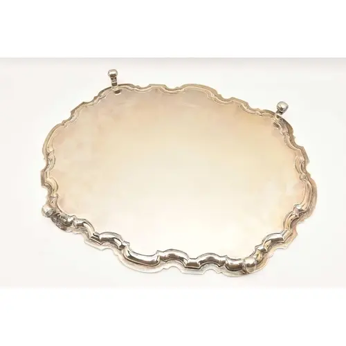 AN EDWARD VIII SILVER FOOTED TRAY, of an oval form with wavy...