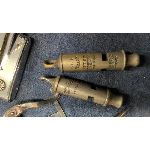 Small vintage accessories including a metal desk clip, a ste...