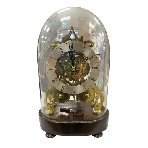 A late Victorian skeleton clock, under a glass dome, with si...
