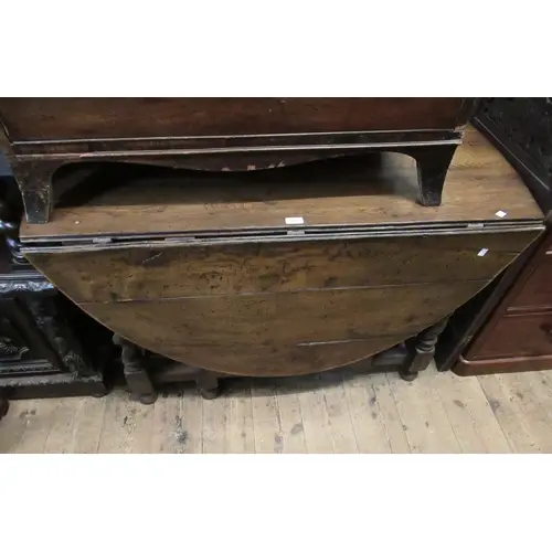 Antique oak gate-leg oval drop-leaf table, on barley twist s...