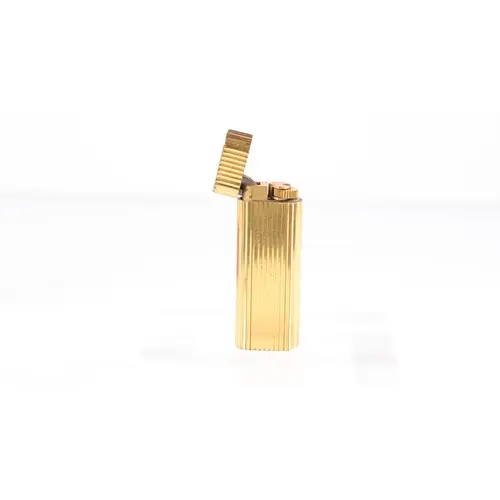 A Vintage Cartier Paris lighter, gold plated case, Numbered ...