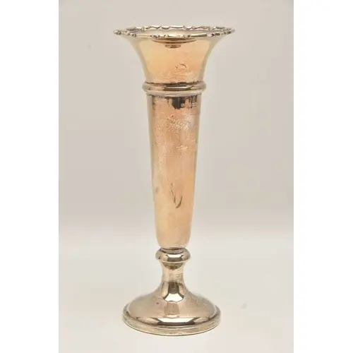 A GEORGE V SILVER VASE, polished tapering form with wavy rim...
