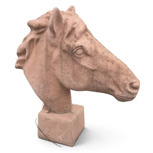 A Terracotta Stone style horses head. H 61 cm approx.