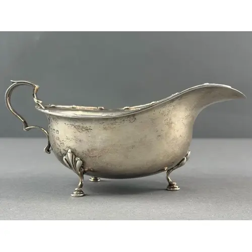 Silver: an oval sauceboat by E S Barnsley & Co, Birmingh...
