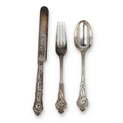 AN ART NOUVEAU CUTLERY SET COMPRISING KNIFE, FORK AND SPOON ...