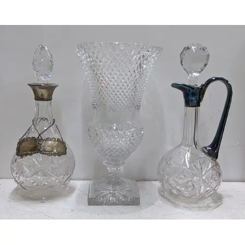 Two glass decanters, one having a silver collar, together wi...