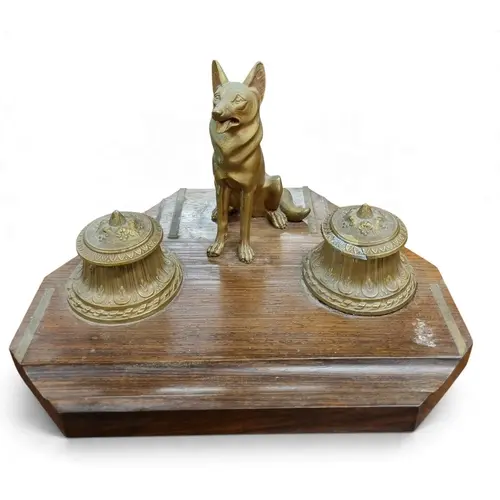 A good early 20th Century Hardwood Desk Stand depicting a Ge...