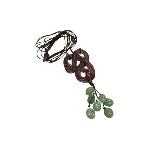 A Lalique amethyst glass and adventurine quartz cluster set ...