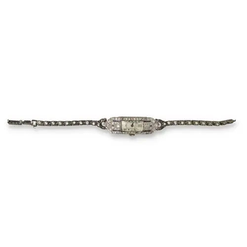 AN ART DECO PLATINUM DIAMOND AND BLUE ENAMEL COCKTAIL WATCH ...