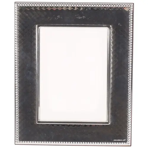 A modern diamond decorated silver-fronted photo frame, with ...