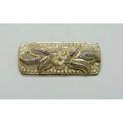 A German Art Deco silver gilt brooch with filigree design se...