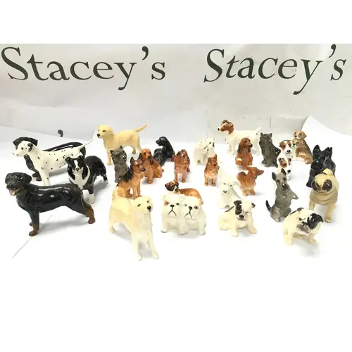 vintage ceramic and porcelain dog figurines, predominantly B...