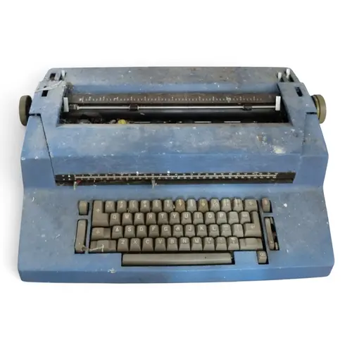 A Vintage blue IBM Selectric II electric Typewriter.